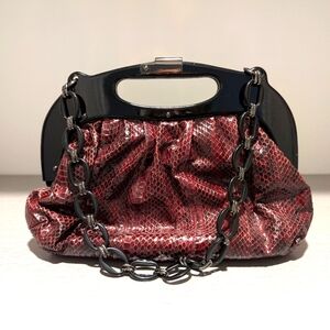 Faux snakeskin clutch with chain strap